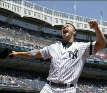  ?? BILL KOSTROUN — THE ASSOCIATED PRESS ?? Nick Swisher reacts when he is introduced during the Yankees Old Timer’s Day ceremonies.