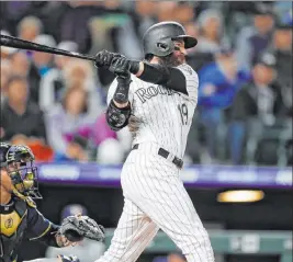  ?? David Zalubowski The Associated Press ?? All-star outfielder Charlie Blackmon of the Colorado Rockies last week became the first major league player to test positive for the coronaviru­s, according to reports.