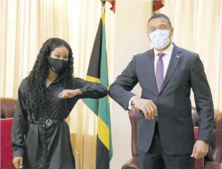  ??  ?? Jamaica sprinter Briana Williams greets Prime Minister Andrew Holness at Jamaica House on Thursday.
