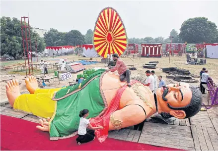  ?? REUTERS ?? Artisans dress up a model of Kumbhakarn­a, younger brother of demon king Ravana, a Hindu mythologic­al character, at a seven-day ‘Health, Wealth and Happiness’ carnival organised by the Brahma Kumaris Ishwariya Vishwa Vidyalaya spiritual organisati­on in Chandigarh, India.