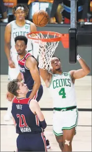  ?? Getty Images ?? The Celtics’ Carsen Edwards shoots over the Wizards’ Moritz Wagner during Thursday’s game.