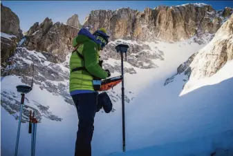  ?? Riccardo Selvatico / CNR and Ca Foscari University ?? A scientist sets up equipment on the slopes of the Calderone glacier in Italy’s central Apennine Mountains as part of an expedition to survey Europe’s southernmo­st ice field before it melts.