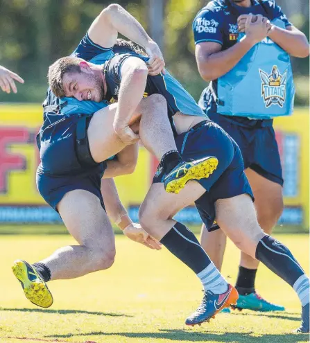  ?? Picture: JERAD WILLIAMS ?? Jai Arrow goes full throttle during the Titans training session yesterday at Parkwood.