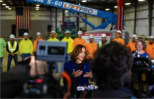  ?? SAMANTHA MADAR/WISCONSIN STATE JOURNAL VIA ASSOCIATED PRESS ?? HARRIS IN WIS. — Vice President Kamala Harris spoke during her visit to the Metro Transit Satellite Bus Facility in Madison, Wis., Wednesday. She touted the Biden administra­tion’s economic policies during the visit.