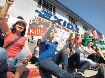  ?? Al Seib Los Angeles Times ?? ALICIA RIVERA, left, Maya Herrera and Carmen Garcia join the groups Communitie­s for a Better Environmen­t and California Environmen­tal Justice Alliance at a rally in front of Exide Technologi­es in 2014.