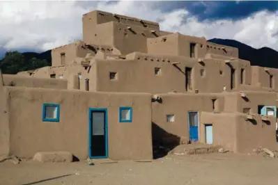  ?? COURTESY OF DEANNA NELSON ?? Taos Pueblo is honored as a living community as well as for its adobe buildings.