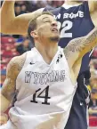  ?? DAVID BECKER/ASSOCIATED PRESS FILE PHOTO ?? Wyoming’s Josh Adams, front, in 2016 at the Mountain West Conference tournament. Adams, who stands only 5 feet 9 inches and has a 45-inch vertical leap, has drawn interest from NBA scouts.