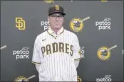  ?? DERRICK TUSKAN — THE ASSOCIATED PRESS ?? New San Diego Padres manager Bob Melvin poses in a team hat and jersey during an introducto­ry press conference at Petco Park on Monday in San Diego.