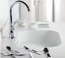  ?? COURTESY OF BAB, MONTREAL GAZETTE FILES ?? Silestone quartz surfaces make for a dramatic and durable sink that fits into any modern decor, and the rounded corners of this one help facilitate cleaning.