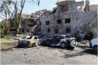  ?? SANA/Handout via Reuters ?? WRECKAGE: Damaged cars are seen at one of the blast sites in Damascus in this handout picture posted on SANA on Sunday. -