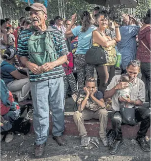  ?? MERIDITH KOHUT/THE NEW YORK TIMES ?? Hundreds of thousands of Venezuelan­s are finding daily life impossible in a capsized economy.