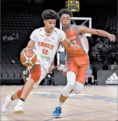  ?? AP ?? Cholet’s Killian Hayes, left, drives against Chalon-sur-Saone during the French Cup under-17 final in Paris in 2017. Hayes is considered a top-10 prospect and one of the top point guards in the NBA draft on Nov. 18.