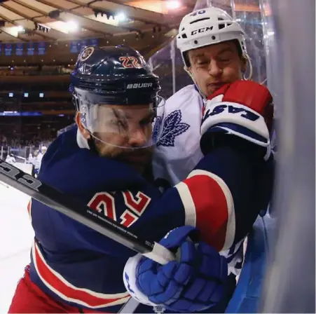  ?? BRUCE BENNETT/GETTY IMAGES ?? The Rangers’ Dan Boyle takes out the Maple Leafs’ Michael Grabner first-period during action Friday night at Madison Square Garden.