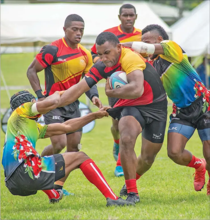  ??  ?? Fire Sevens Tira Wilagi tries to break away from Taveuni Raiwasa’s defence during the Fiji Rugby Union’s Super Sevens Series at Sigatoka’s Lawaqa Park on January 22, 2021. Photo: Leon Lord