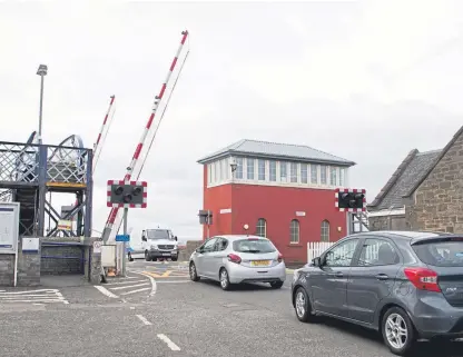  ?? Picture: Paul Reid. ?? The level crossing barrier at Carnoustie: Scene of a “moment of madness”.