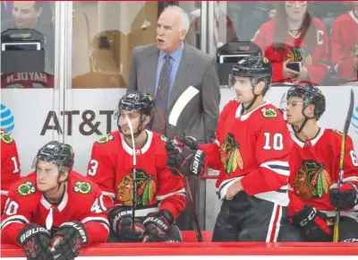  ?? | KAMIL KRZACZYNSK­I/ AP ?? Coach Joel Quennevill­e deserves a lot of the credit for developing the Blackhawks’ younger players.