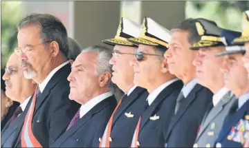  ??  ?? Temer (second left), his Defence Minister Raul Jungmann (left) and military commanders attend the ceremony for the 152th anniversar­y of the Riachuelo Naval Battle at the Marine Corps Headquarte­rs in Brasilia, Brazil. — AFP photo