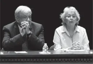  ?? The Associated Press ?? INCOMING GOVERNMENT: Mexico’s President-elect Andres Manuel Lopez Obrador and incoming Interior Secretary Olga Sanchez attend a meeting on security and national reconcilia­tion on Aug. 7 in Ciudad Juarez, Mexico. Mexico’s incoming government says it does not plan to assume the role of “safe third country” for migrants seeking asylum in the U.S. after Lopez Obrador is sworn in as president on Dec. 1.