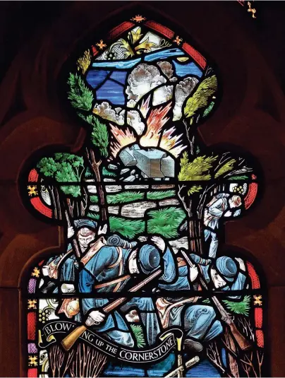  ?? PHOTOS BY LARRY MCCORMACK/THE TENNESSEAN ?? Stained glass windows seen Sept. 22 depict Union soldiers blowing up the cornerston­e of the university during the Civil War. A number of panels tell the history of The University of the South inside All Saints Chapel in Sewanee, Tenn.
