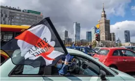  ??  ?? Drivers with flags take part in a protest of Polish women’s rights activists using cars and bicycles to block central Warsaw. Photograph: Wojtek Radwański/AFP via Getty Images