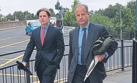  ??  ?? Cadogan arrives at the Justice of the Peace Court in Perth with his father, Viscount Chelsea.