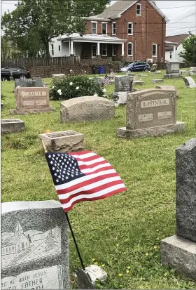  ?? PHOTO COURTESY OF CATHY SKITKO ?? Memorial Day flags were placed at the grave sites of veterans in Pottstown’s Edgewood Cemetery Sunday.