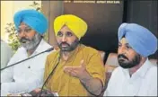  ?? HT PHOTO ?? (From left) Leader of opposition in assembly Harpal Singh Cheema, AAP’s Sangrur MP Bhagwant Maan and party’s Budhlada MLA Budh Ram at a press conference in Chandigarh.