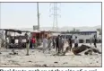  ??  ?? Residents gather at the site of a suicide bomb attack in Tuz Khurmato, 170 km (105 miles) north of the Iraqi capital Baghdad, July 28, 2013. (Reuters)