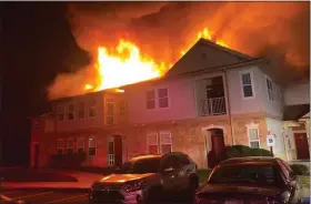  ?? PHOTO BY HENRY PETERMAN, COURTESY OF RIDGE FIRE COMPANY ?? A fire in the Orchard Ridge apartments in East Coventry early Saturday has left 14families homeless.