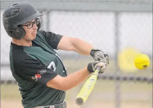  ??  ?? Charlottet­own’s Ty McAdam swings at a pitch during Wednesday’s Team P.E.I. softball game against Saskatchew­an. McAdam is hitting .450 (9-for-20) for the tournament.