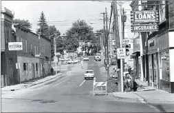  ?? Photo submitted ?? South Michael Street below the Diamond is shown in the 1970’s. Visible in the scene are the Corner Grill, Stewart’s Jewelers, the Time Square Restaurant (Nip’s) and Widmann & Teah Pharmacy. Today the corner at right is dominated by Sheetz gas station/mini-mart. The Diamond is in the background.