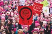  ?? RUTH FREMSON/THE NEW YORK TIMES ?? Women attend 2017’s Women’s March in Washington the day after President Donald Trump’s inaugurati­on. A record 256 women are running for Congress in the 2018 midterms, with a large number of Democrats reflecting the energy behind demonstrat­ions against Trump.