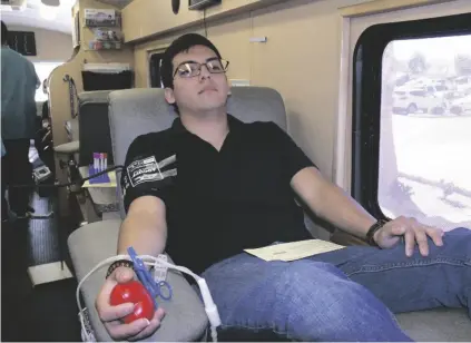  ?? WILLIAM ROLLER PHOTO ?? Miguel Verdugo, an Imperial Valley College second year administra­tion of justice student, donated blood in the LifeStream Donation Center’s Blood Mobile in front of the DePaoli Sports Complex in Imperial, in 2016.