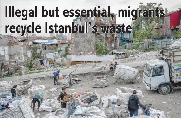  ?? ?? Afghan refugees packing waste into bales at a makeshift dumping ground in Istanbul. — AFP photos