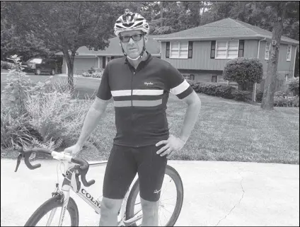  ?? BILL TORPY / BTORPY@AJC.COM ?? Mike Smith, a 47-year-old dad from Dunwoody, was forced to turn bare-knuckled pugilist during a bike ride in Sandy Springs.