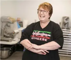  ?? Benjamin B. Braun/Post-Gazette ?? Kelly Olinger, owner of Valentino Cheese, sells hundreds of pounds of fresh Italian ricotta and basket cheese each week in her New Castle shop.