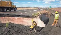  ??  ?? Workers begin repairing a section of U.S. 89 north of Flagstaff on Thursday. A portion of the road collapsed, and a subsequent crash left a woman from France dead. MARK HENLE/ THE REPUBLIC