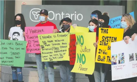  ?? DAN JANISSE ?? A small group people participat­e in a justice rally on Friday in front of the Ontario Court of Justice in Windsor to call attention to victims of violence and express their belief that the justice system is too lenient on violent criminals.