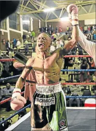  ?? Picture: STEPHANIE LLOYD ?? LOUD AND CLEAR: Lusanda Komanisi shouts with joy after winning the IBO world featherwei­ght title fight against Roli Gasca