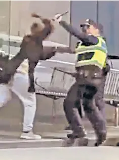  ??  ?? Screenshot­s taken from a video show police in Melbourne tackling a man armed with a knife in Bourke Street yesterday. Bystanders were yelling at police: ‘Just shoot him, just shoot him’. The attacker, later named as Mohamed Khalif, was shot in the chest and killed