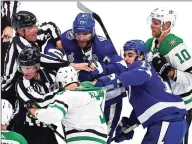  ?? Bruce Bennett / Getty Images ?? The Lightning’s Victor Hedman (77) and Cedric Paquette (13) scuffle with the Stars’ John Klingberg (3) during Game 2 of the Stanley Cup Final on Monday.