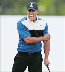  ?? CHARLES KRUPA/AP PHOTO ?? Brooks Koepka reacts after sinking a putt on the 18th green to win the PGA Championsh­ip on Sunday at Bethpage Black in Farmingdal­e, N.Y.