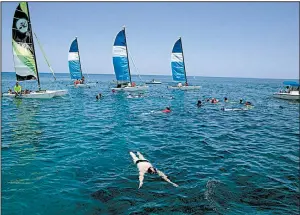  ?? AP/ISMAEL FRANCISCO ?? Tourists get in some snorkeling recently off a beach in Varadero, Cuba. The Cuban government has set a goal of drawing 5 million visitors this year.