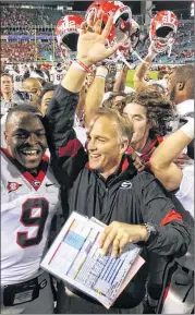  ?? AJC FILE. ?? Former coach Mark Richt and the Bulldogs were frequent preseason darlings in the AP poll, but by the postseason poll fell the farthest and most frequently of any program in the past 10 seasons, including from No. 5 to unranked in 2013.