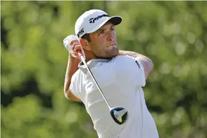  ?? DARRON CUMMINGS/ASSOCIATED PRESS ?? Jon Rahm of Spain hits from the 18th tee during the third round of the Memorial golf tournament Saturday in Dublin, Ohio.