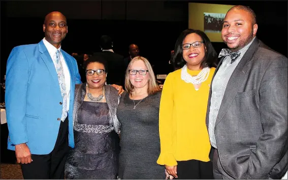  ?? NWA Democrat-Gazette/CARIN SCHOPPMEYE­R ?? Henry Smith (from left), Angela Mosley-Monts, Dawn James, Javannah Hinton and Todd Jenkins gather at the 22nd annual Dr. Martin Luther King Jr. Recommitme­nt Banquet on Jan. 15 evening at the Fayettevil­le Town Center.