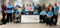  ??  ?? Moose Jaw Families for Change workers and clients accept a cheque for $10,119 from the Moose Jaw Co- Op, proceeds from the Co- Op's annual good fuel days.