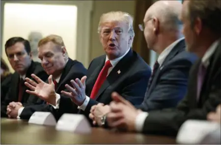  ?? EVAN VUCCI — THE ASSOCIATED PRESS ?? President Donald Trump speaks during a meeting with steel and aluminum executives in the Cabinet Room of the White House, Thursday in Washington. From left, Roger Newport of AK Steel, John Ferriola of Nucor, Trump, Dave Burritt of U.S. Steel...