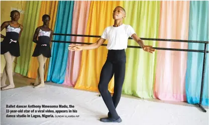  ?? SUNDAY ALAMBA/AP ?? Ballet dancer Anthony Mmesoma Madu, the 11-year-old star of a viral video, appears in his dance studio in Lagos, Nigeria.