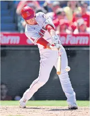  ?? USA TODAY SPORTS ?? The Angels’ David MacKinnon breaks his bat on an RBI single against the Mariners.